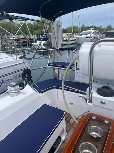 Rita Gale Yacht Photos Pics Cockpit of 2012 Catalina 355 sailboat with blue cushions, docked at marina.