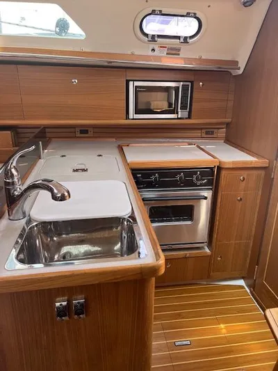 Rita Gale Yacht Photos Pics Catalina 355 yacht kitchen with sink, stove, and microwave, 2012 model.