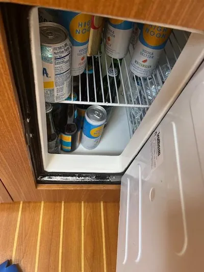 Rita Gale Yacht Photos Pics Mini fridge stocked with canned drinks on a 2012 Catalina 355 boat.