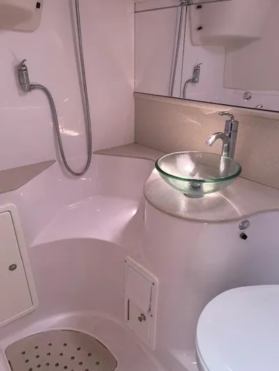 Rita Gale Yacht Photos Pics Modern bathroom in 2012 Catalina 355 yacht with glass sink and shower.