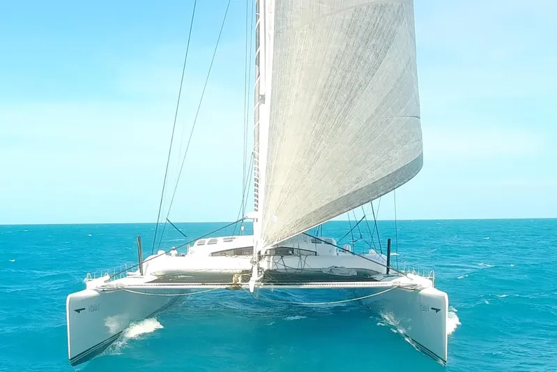 Vitalia II Yacht Photos Pics High-performance Multiplast catamaran sailing on open sea, 2003 model.