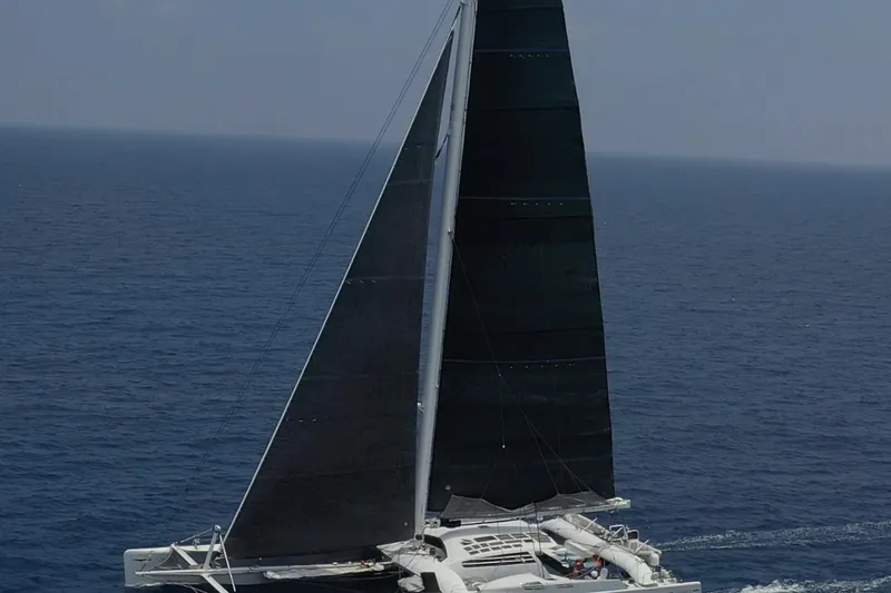 Vitalia II Yacht Photos Pics 2003 Multiplast High Performance Catamaran sailing on open sea.