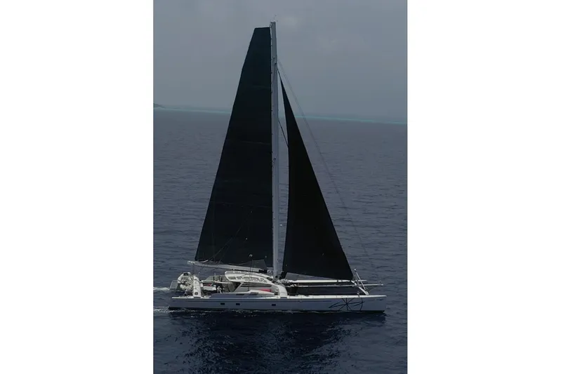 Vitalia II Yacht Photos Pics High-performance Multiplast catamaran sailing on open sea, 2003 model.