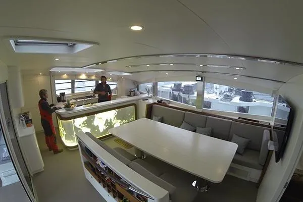 Vitalia II Yacht Photos Pics Luxurious interior of a 2003 Multiplast High Performance Catamaran with modern dining area.