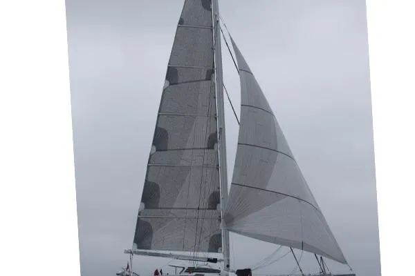 Vitalia II Yacht Photos Pics 2003 Multiplast High Performance Catamaran sailing under cloudy skies.