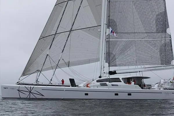 Vitalia II Yacht Photos Pics 2003 Multiplast High Performance Catamaran sailing on open water.