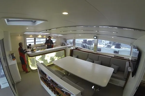 Vitalia II Yacht Photos Pics Interior of a 2003 Multiplast High Performance Catamaran with modern dining area and kitchen.