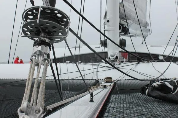 Vitalia II Yacht Photos Pics High-performance Multiplast catamaran from 2003, showcasing intricate rigging and deck details.