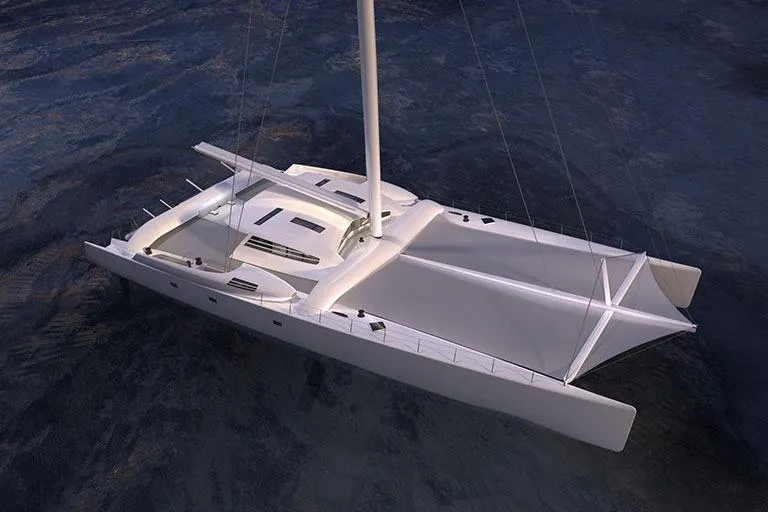 Vitalia II Yacht Photos Pics High-performance 2003 Multiplast catamaran sailing on calm waters, showcasing sleek design and structure.