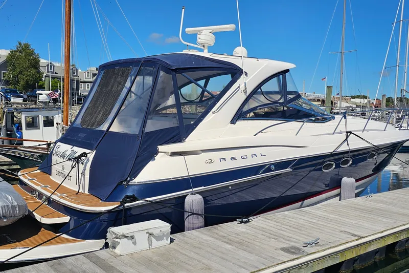  Yacht Photos Pics 2005 Regal Commodore 4260 yacht docked at marina under clear blue sky.