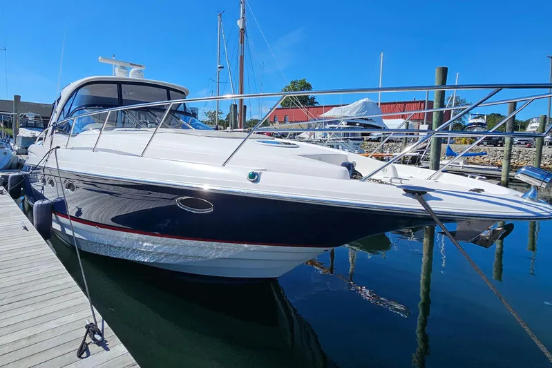  Yacht Photos Pics 2005 Regal Commodore 4260 yacht docked at marina under clear blue sky.