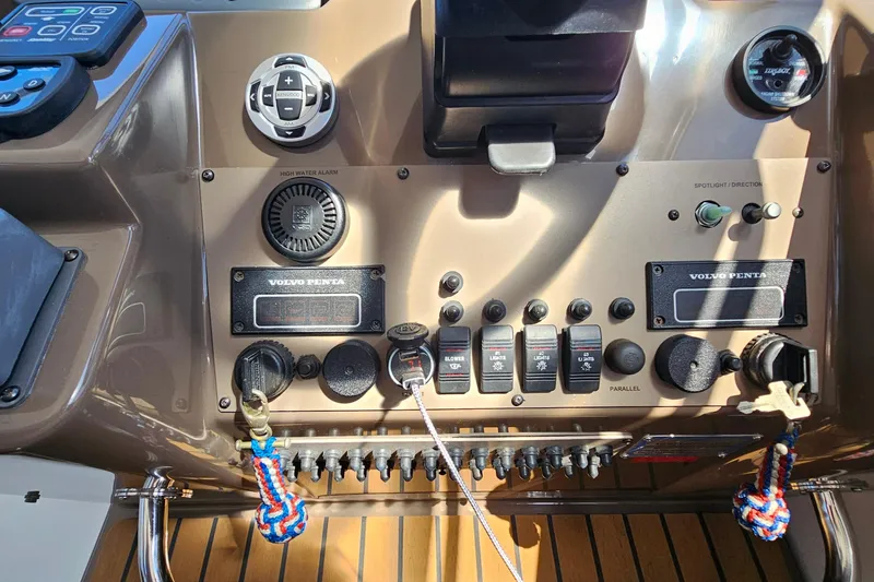  Yacht Photos Pics Control panel of a 2005 Regal Commodore 4260 boat with various switches and gauges.