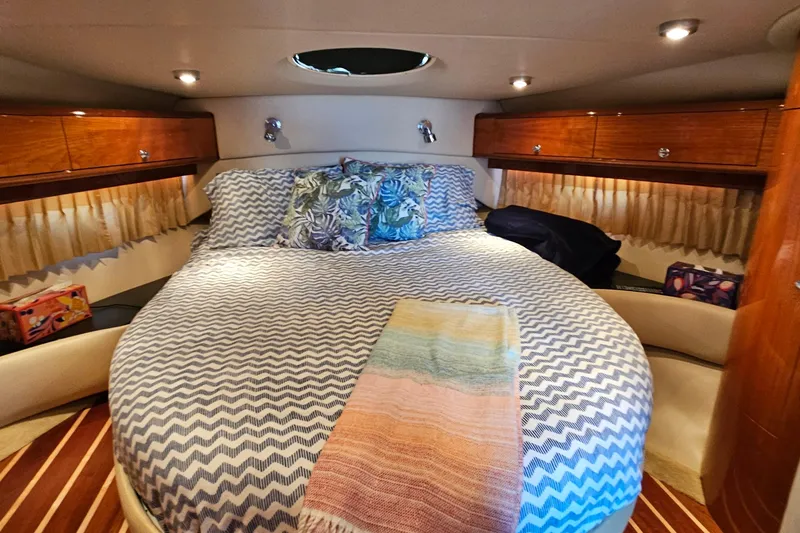  Yacht Photos Pics Luxurious cabin interior of 2005 Regal Commodore 4260 yacht with cozy bedding.