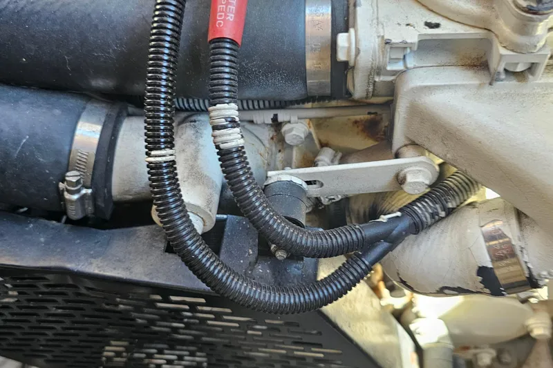  Yacht Photos Pics Close-up of 2005 Regal Commodore 4260 engine components with hoses and wiring.