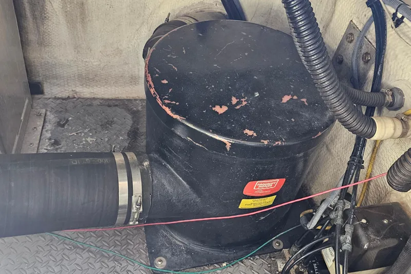  Yacht Photos Pics Engine compartment of a 2005 Regal Commodore 4260 with visible hoses and components.