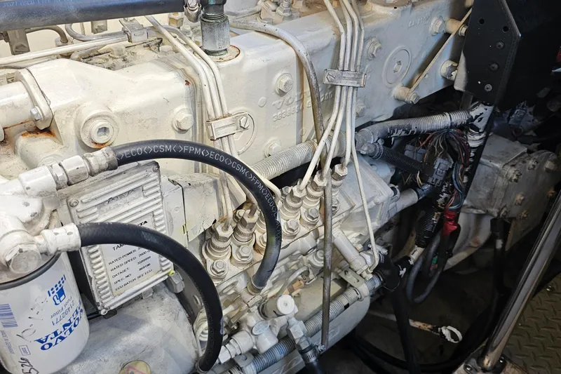  Yacht Photos Pics Engine components of a 2005 Regal Commodore 4260, showcasing hoses and wiring.