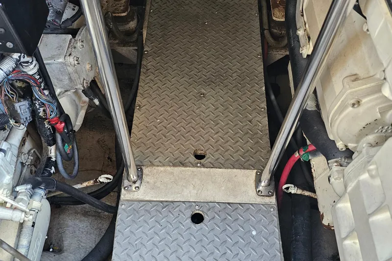  Yacht Photos Pics Engine room of 2005 Regal Commodore 4260 with metal flooring and visible wiring.