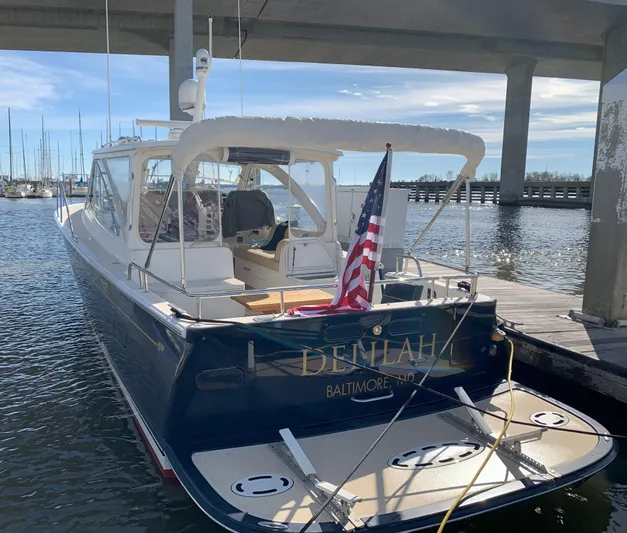 Delilah Yacht Photos Pics 2011 MJM 40z Downeast boat docked, rear view with American flag, named Delilah from Baltimore, MD.
