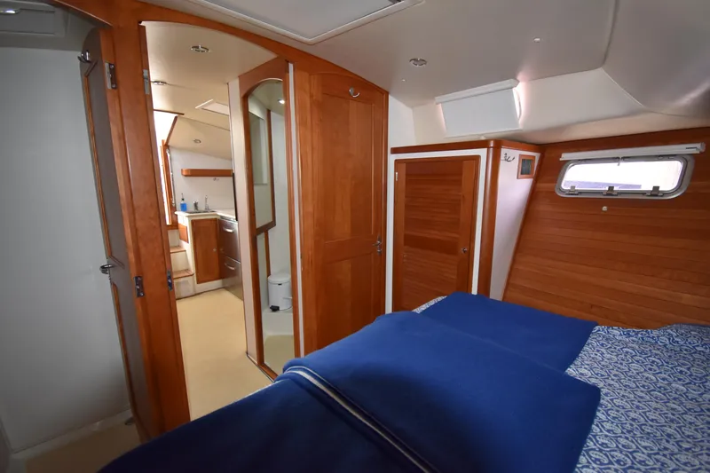 Delilah Yacht Photos Pics 2011 MJM 40z Downeast yacht interior with wooden finishes and cozy bedroom.