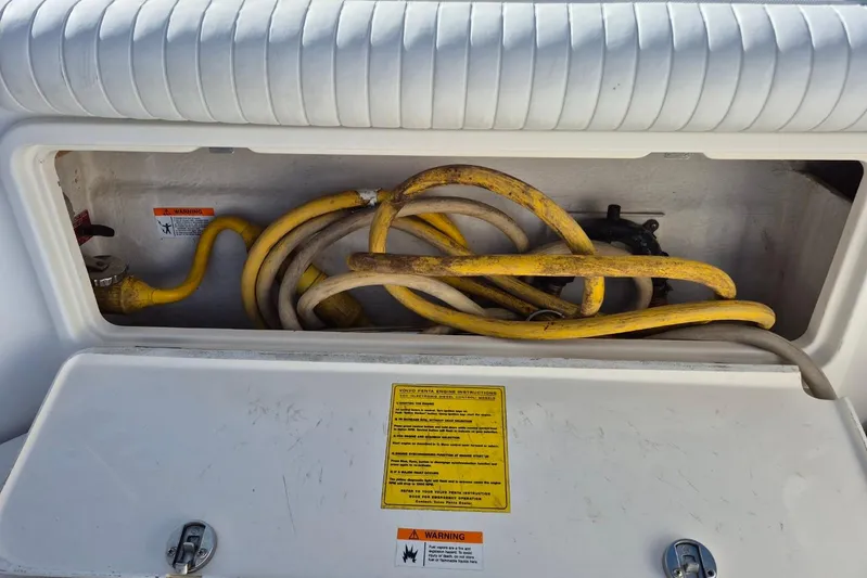  Yacht Photos Pics Storage compartment with yellow cables in a 2004 Riviera 4000 Offshore boat.