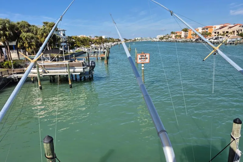  Yacht Photos Pics 2004 Riviera 4000 Offshore view, calm marina waters, idle speed sign, sunny day.