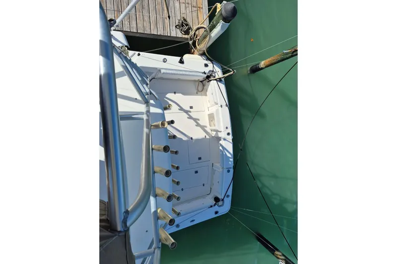  Yacht Photos Pics 2004 Riviera 4000 Offshore boat docked, viewed from above, showing deck and mooring lines.