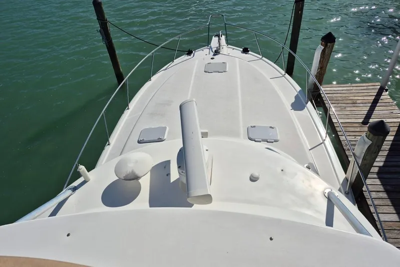  Yacht Photos Pics 2004 Riviera 4000 Offshore boat docked, aerial view of deck and surrounding water.