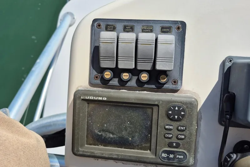  Yacht Photos Pics Control panel of a 2004 Riviera 4000 Offshore boat with navigation switches.