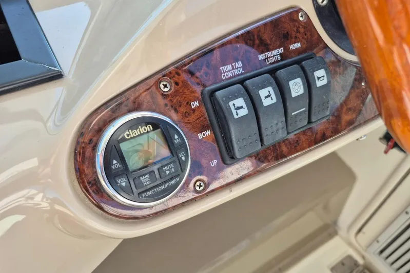  Yacht Photos Pics 2004 Riviera 4000 Offshore control panel with Clarion audio system and switches.