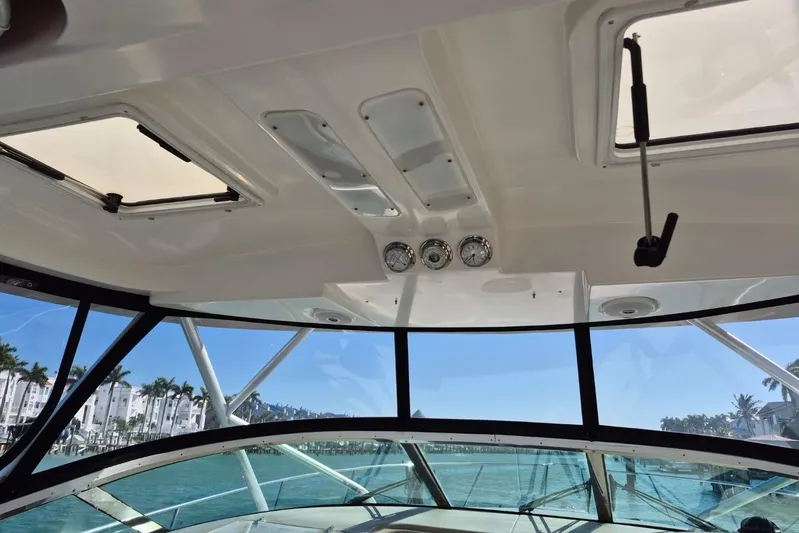  Yacht Photos Pics Interior view of 2004 Riviera 4000 Offshore boat with clear windows and gauges.