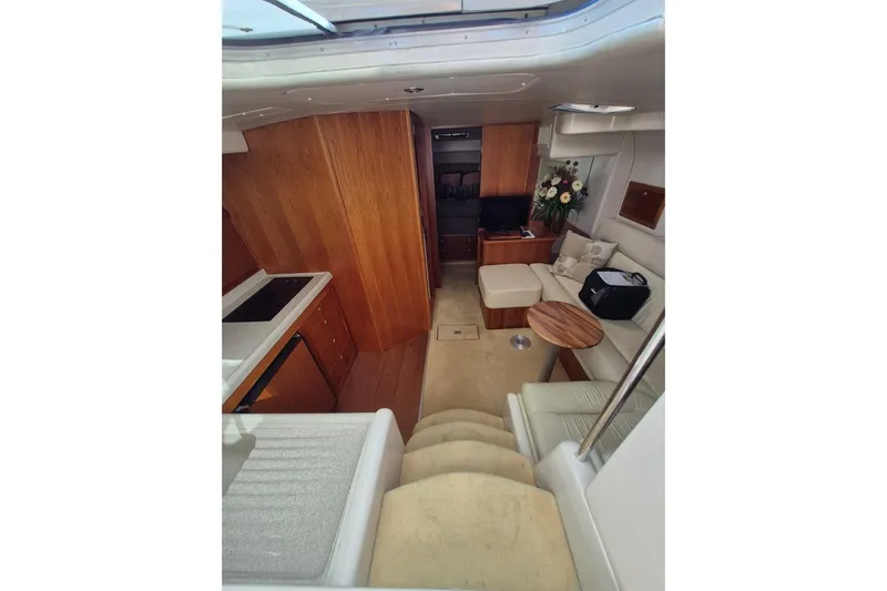  Yacht Photos Pics Interior of 2004 Riviera 4000 Offshore yacht with cozy seating and modern amenities.