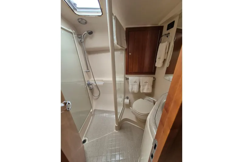  Yacht Photos Pics Bathroom interior of 2004 Riviera 4000 Offshore yacht with shower and toilet.