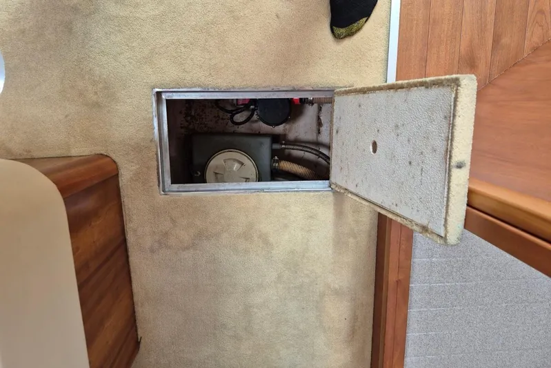  Yacht Photos Pics Open hatch on 2004 Riviera 4000 Offshore boat, revealing interior compartment.