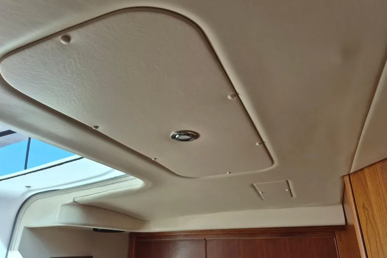  Yacht Photos Pics Interior ceiling of a 2004 Riviera 4000 Offshore yacht, featuring a sleek design.