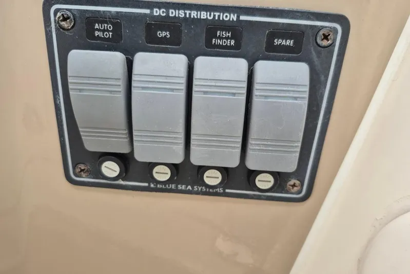  Yacht Photos Pics Control panel on 2004 Riviera 4000 Offshore boat with autopilot, GPS, and fish finder switches.