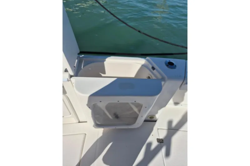  Yacht Photos Pics 2004 Riviera 4000 Offshore boat deck with storage compartment and water view.