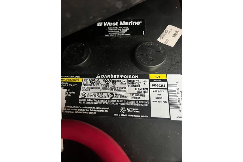Monlove Yacht Photos Pics Battery warning label on a West Marine product, featuring safety instructions and specifications.