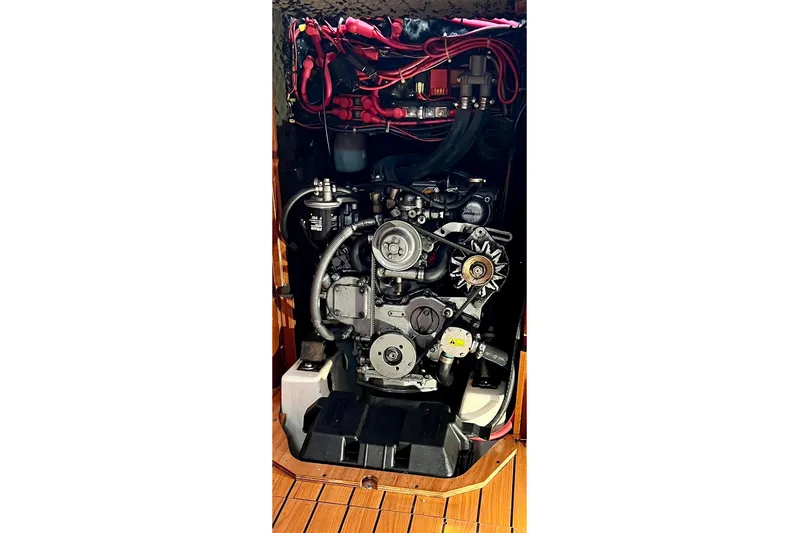 Monlove Yacht Photos Pics Engine compartment of a 2007 Beneteau 393 sailboat, showcasing mechanical components and wiring.