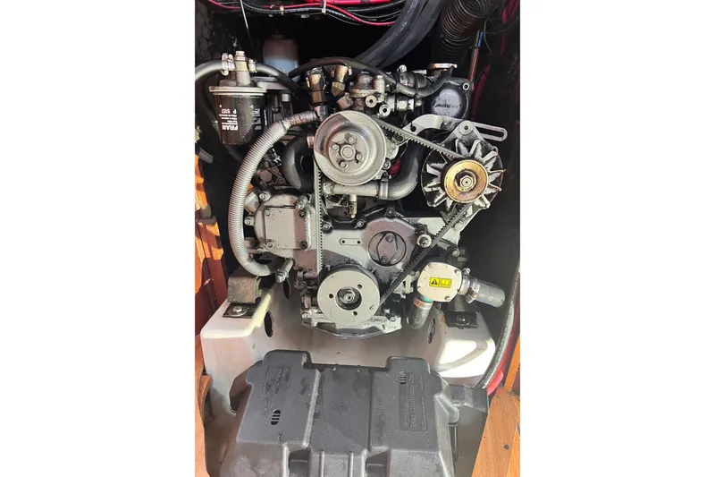 Monlove Yacht Photos Pics Engine of a 2007 Beneteau 393 sailboat, showcasing mechanical components and wiring.