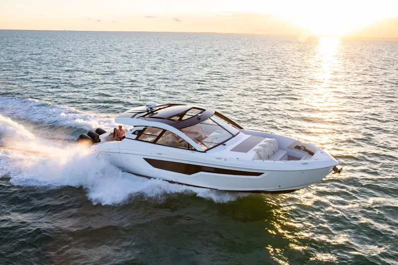  Yacht Photos Pics 2026 Cruisers Yachts 50 GLS cruising at sunset on open water.