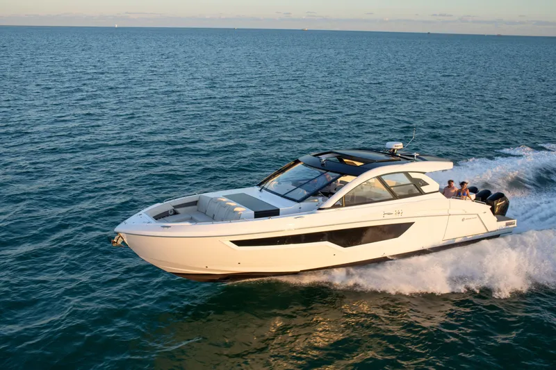  Yacht Photos Pics 2026 Cruisers Yachts 50 GLS cruising on open water, showcasing sleek design and luxury.