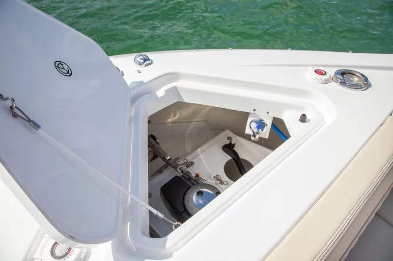  Yacht Photos Pics 2026 Cruisers Yachts 50 GLS anchor locker with open hatch, showcasing storage and equipment.