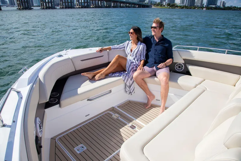  Yacht Photos Pics Couple relaxing on 2026 Cruisers Yachts 50 GLS, enjoying a sunny day on the water.