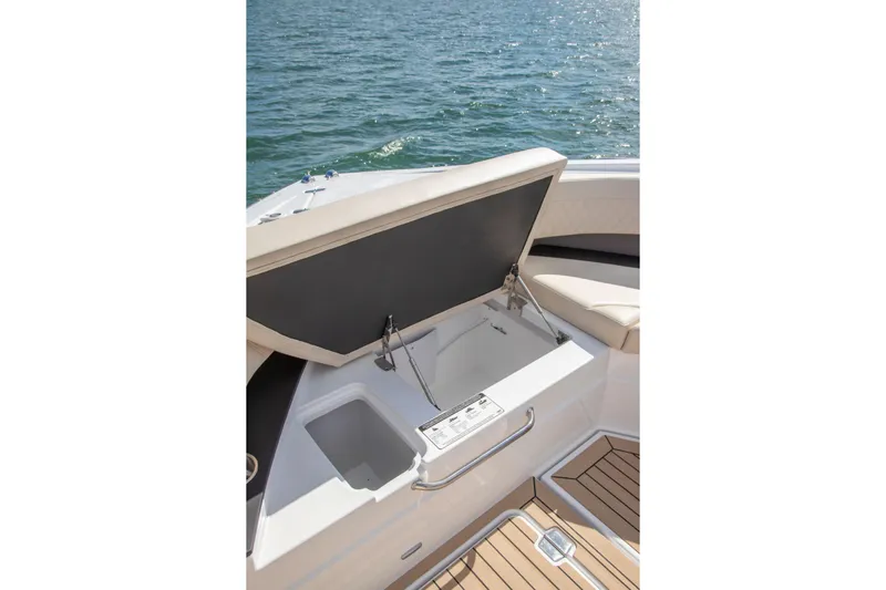  Yacht Photos Pics 2026 Cruisers Yachts 50 GLS boat with open storage compartment on deck.