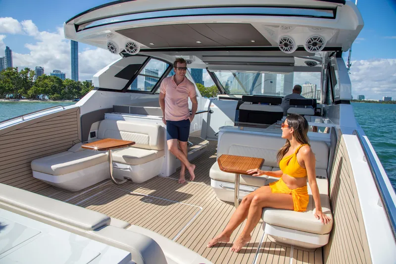  Yacht Photos Pics 2026 Cruisers Yachts 50 GLS luxury deck with people enjoying the sun and sea views.