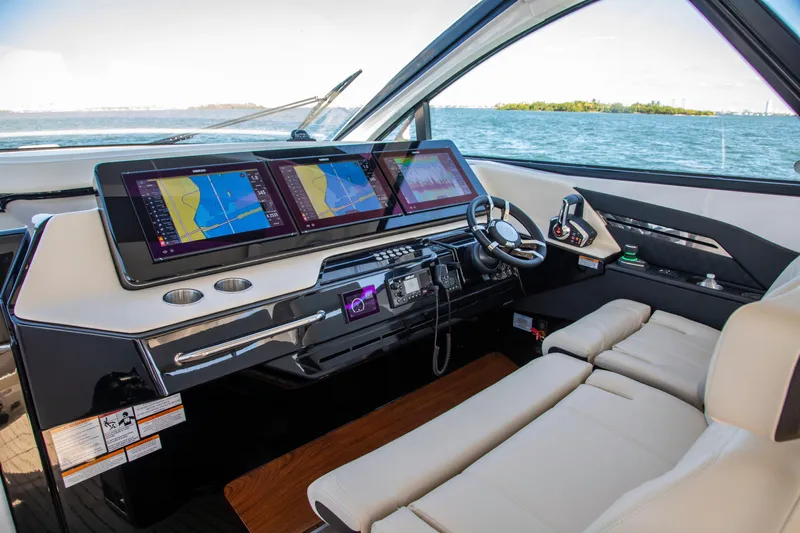  Yacht Photos Pics Luxurious helm of 2026 Cruisers Yachts 50 GLS with advanced navigation displays.
