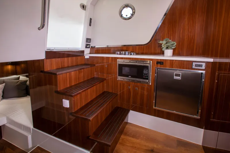  Yacht Photos Pics Luxurious interior of 2026 Cruisers Yachts 50 GLS with modern kitchen amenities.