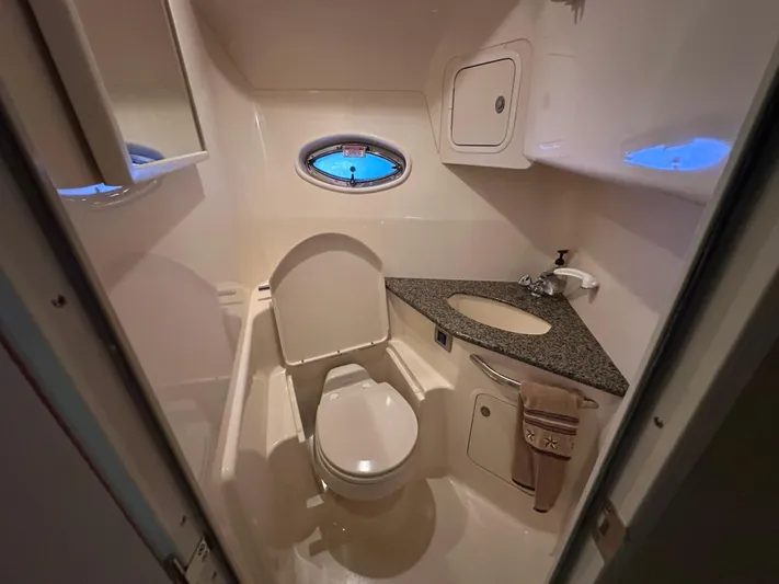  Yacht Photos Pics Bathroom interior of 2005 Sea Ray 420 Sundancer yacht, featuring toilet and sink.
