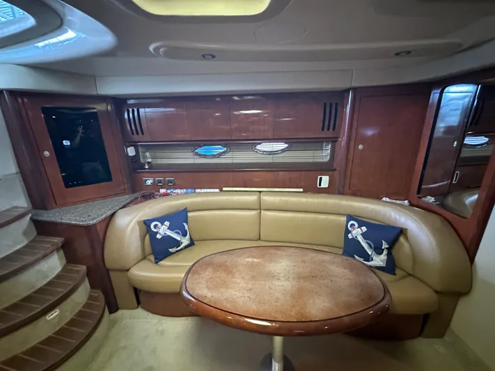  Yacht Photos Pics Luxurious interior of 2005 Sea Ray 420 Sundancer yacht with leather seating and wooden accents.