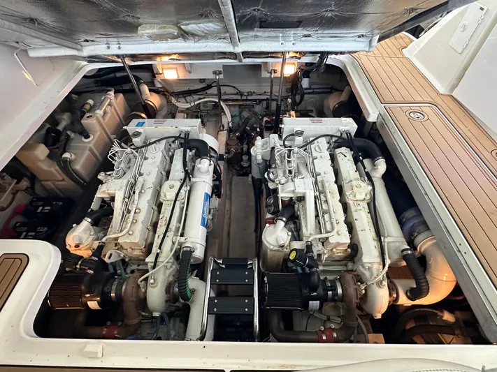  Yacht Photos Pics Engine room of a 2005 Sea Ray 420 Sundancer, showcasing dual marine engines.